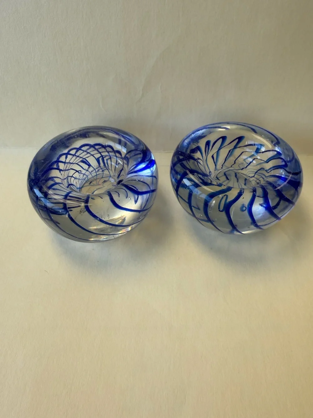 Pair of Handmade Art Glass Paperweight Candle Holders. Clear with Blue Swirl.